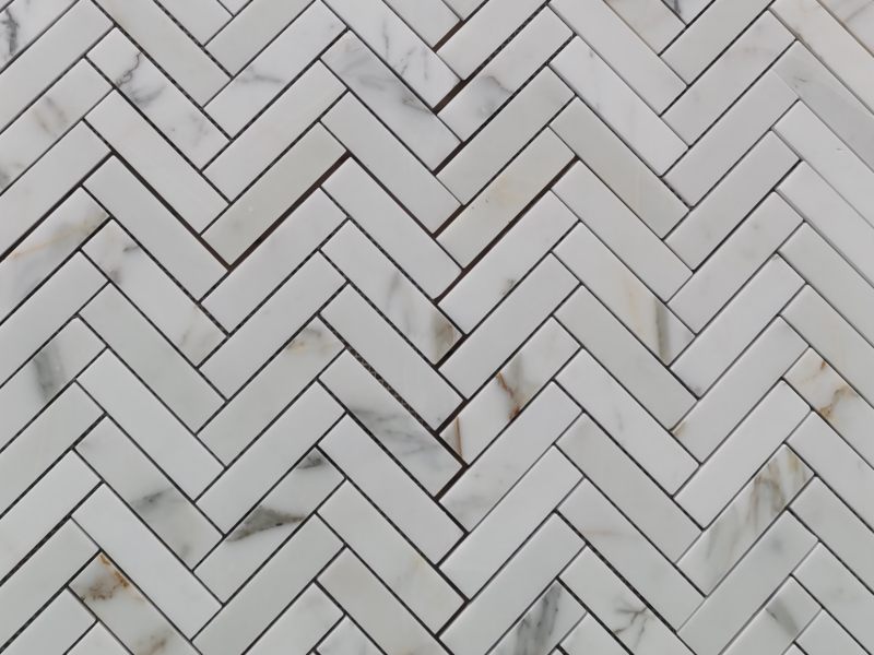 https://www.wanpomosaic.com/wholesale-italian-calacatta-herringbone-marble-mosaic-tile-company-product/