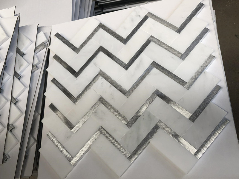 https://www.wanpomosaic.com/wholesale-metal-inlay-marble-herringbone-mosaic-tile-for-wall-product/