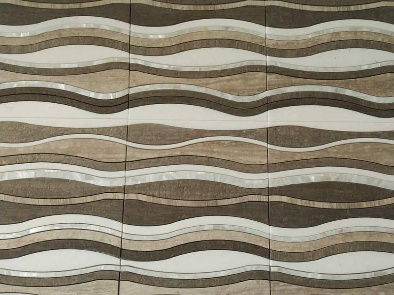 https://www.wanpomosaic.com/modern-wall-design-of-brown-waterjet-wavy-pattern-marble-mosaic-tile-product/