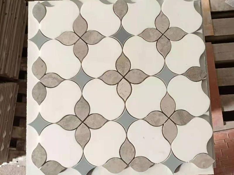 https://www.wanpomosaic.com/polished-marble-mosaic-tile-artistic-waterjet-iris-pattern-wall-tiles-product/