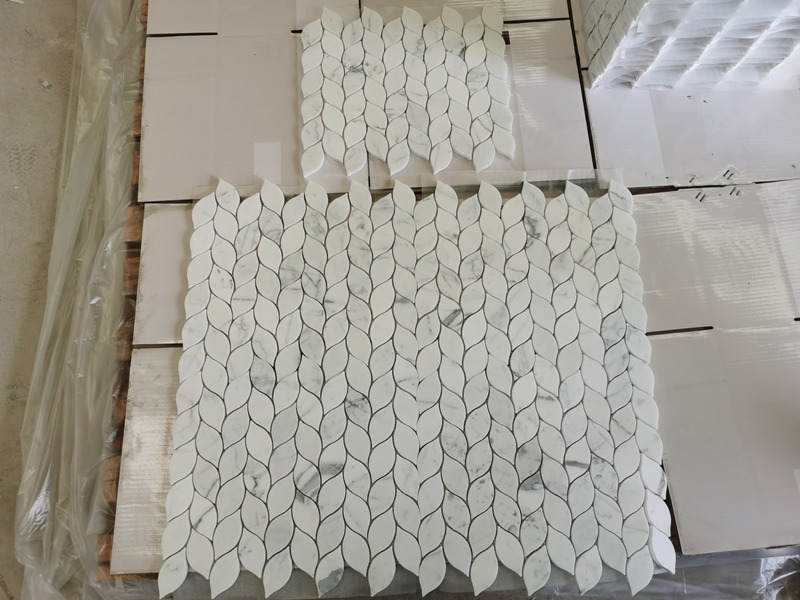 https://www.wanpomosaic.com/best-bianco-carrara-white-marble-mosaic-pattern-waterjet-leaf-tiles-product/